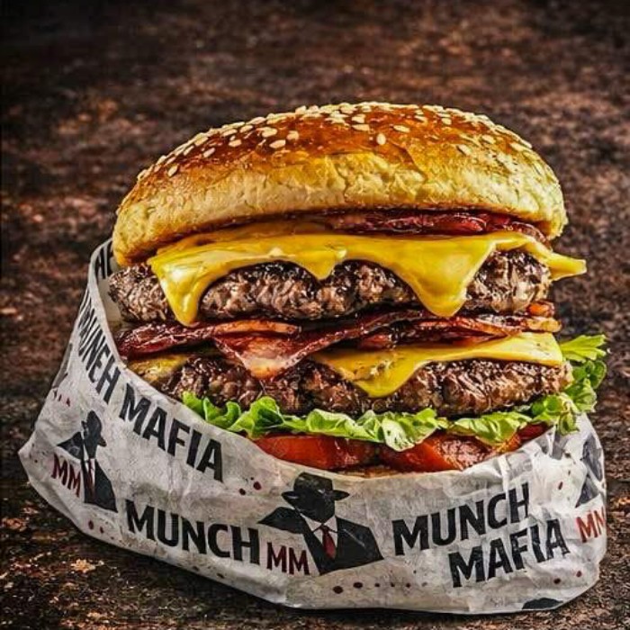 Juicy burger wrapped in a paper served at Munch Mafia Takeaway in 
Greenock 